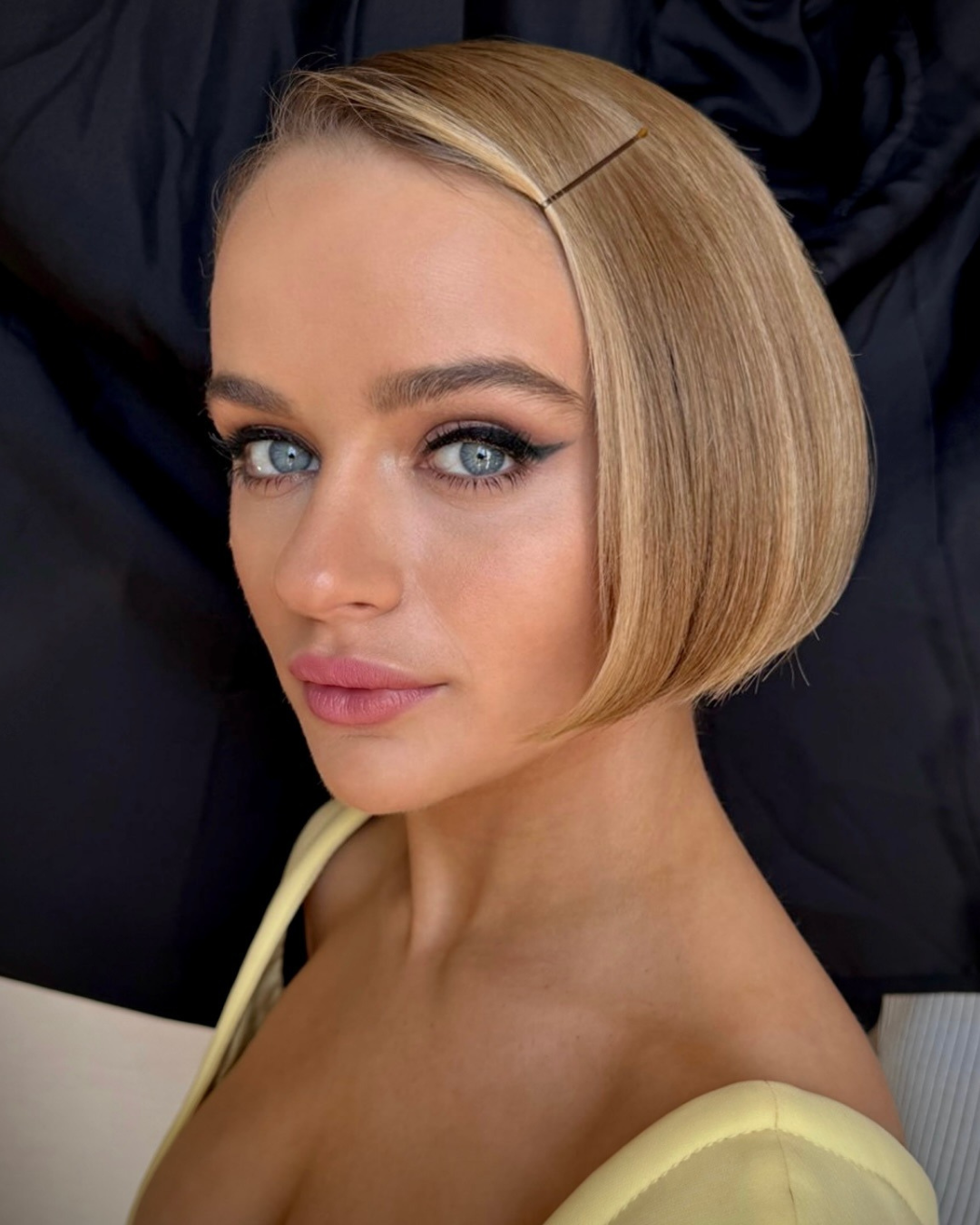 Joey King wearing a sleek, chin-grazing Prada bob styled by Dimitris Giannetos.