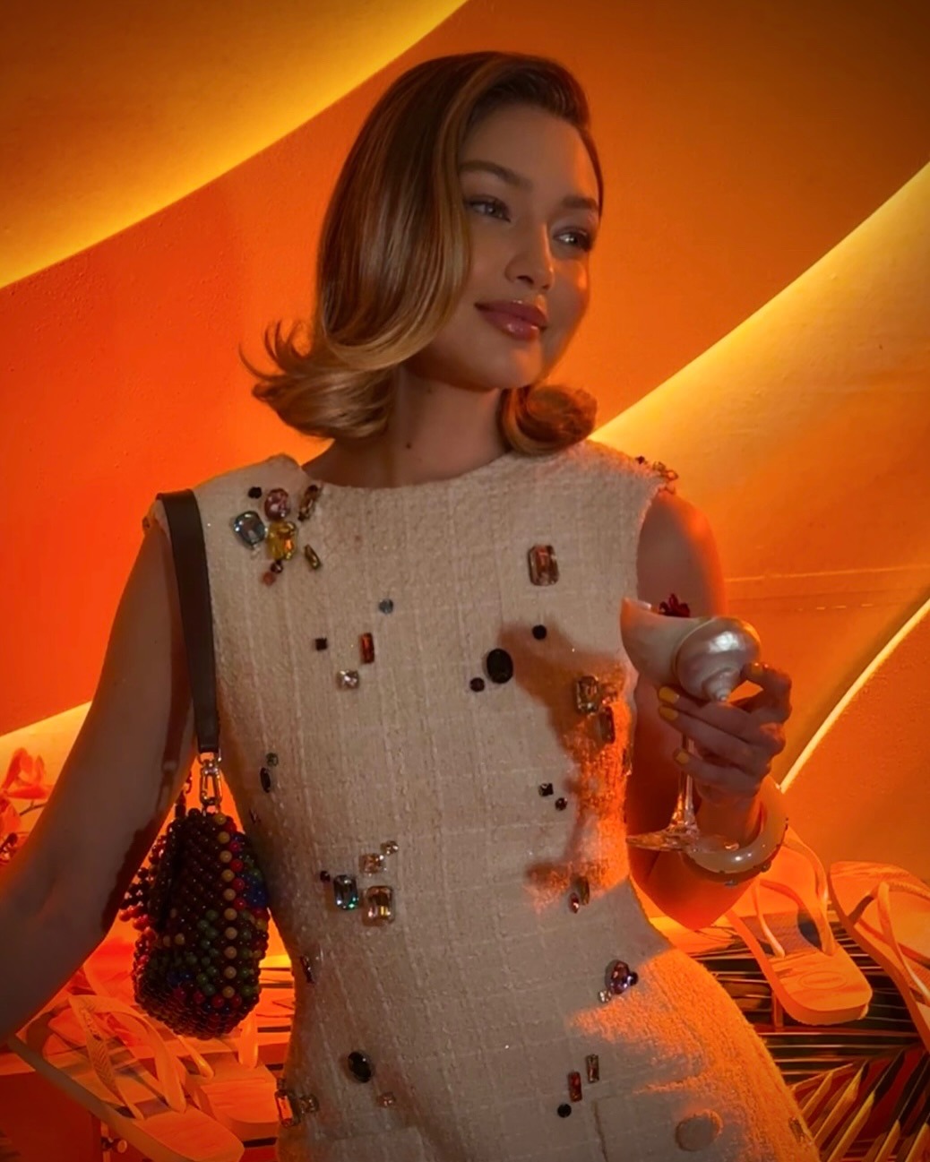 Gigi Hadid wearing a flip-flop swooping bob styled by Dimitris Giannetos.