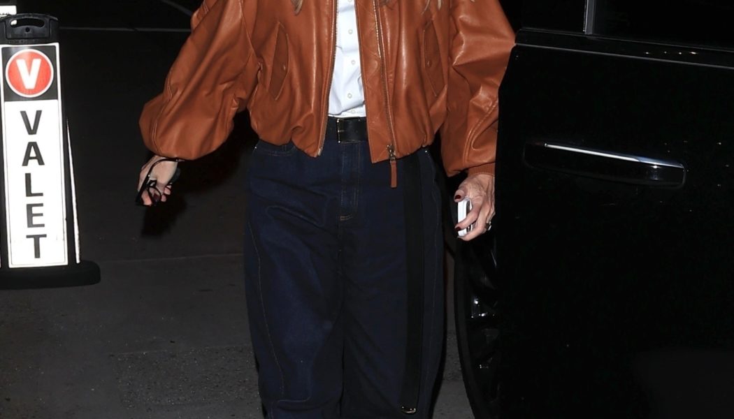 Fashion People in Their 50s Are Wearing This Anti-Skinny Denim Trend With Black Flats