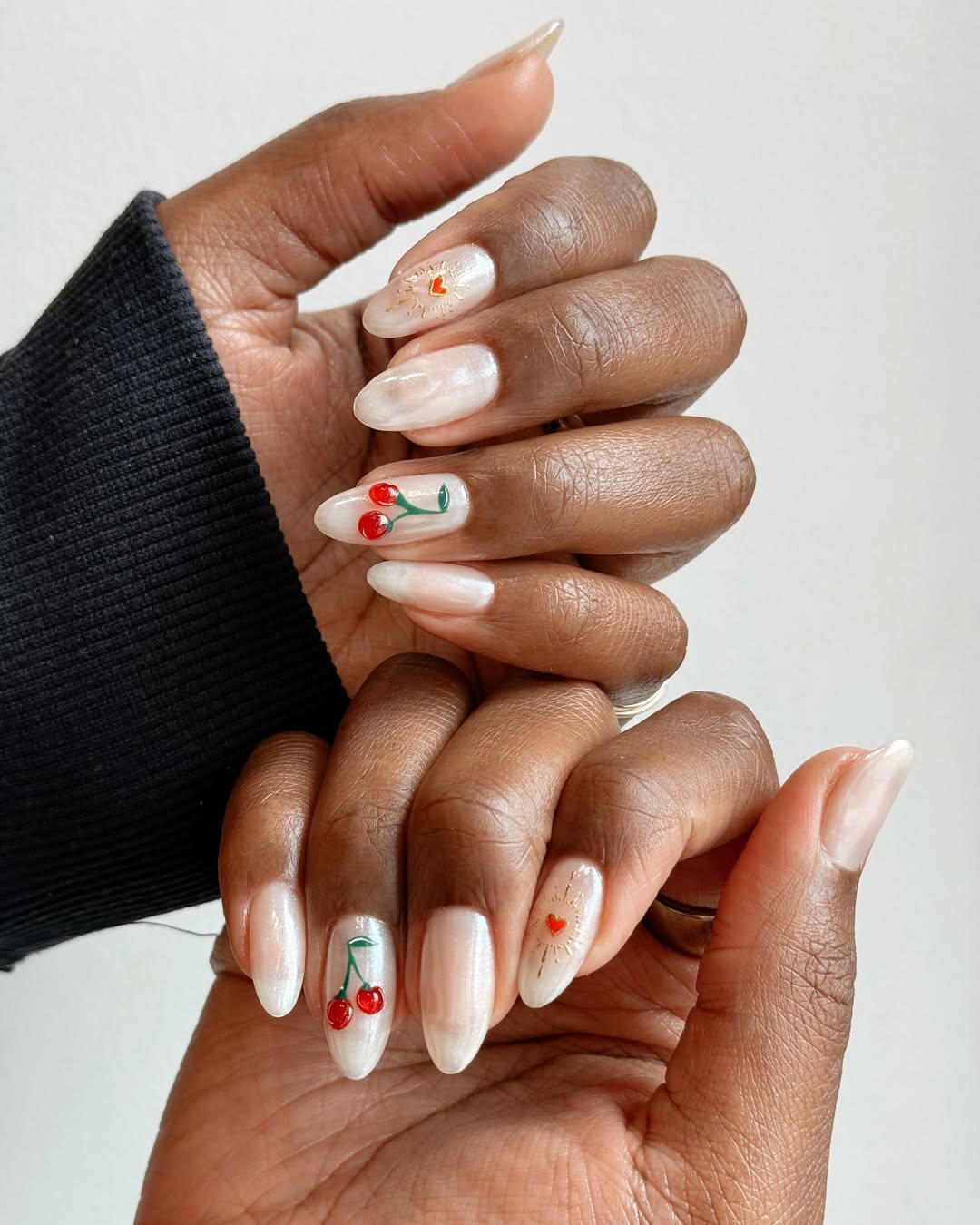 A manicure with vintage-inspired nail art by Queenie Nguyen