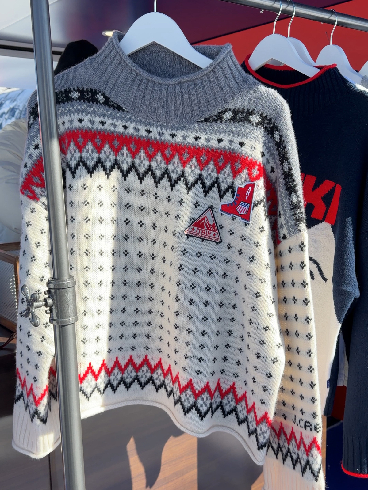 A photo of the viral Fair-Isle sweater at J.Crew's pop-up in Aspen celebrating the U.S. Ski & Snowboard partnership.