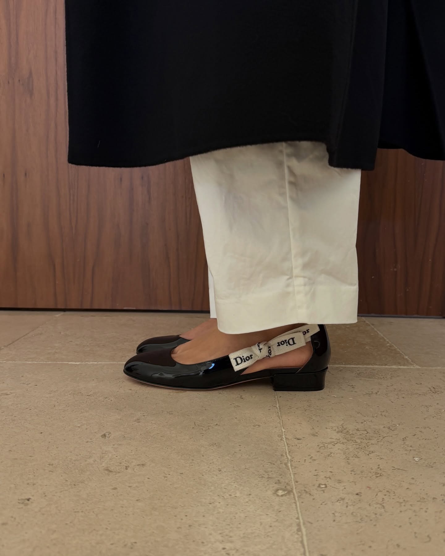 Photos of Aimee Song wearing the new Jonathan Anderson for Dior J'Adior patent leather ballet flats from the spring/summer 2026 collection.