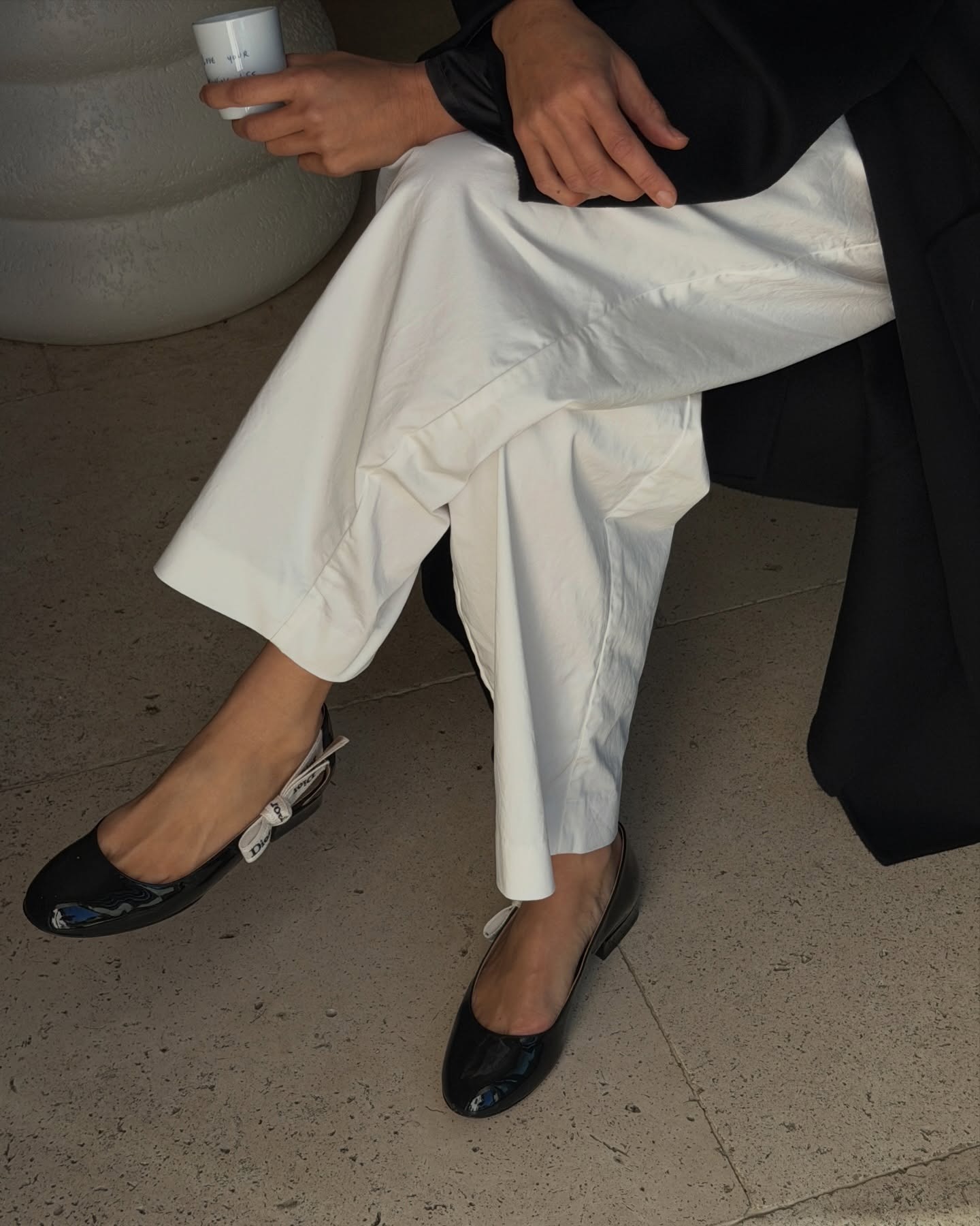 Photos of Aimee Song wearing the new Jonathan Anderson for Dior J'Adior patent leather ballet flats from the spring/summer 2026 collection.