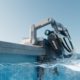 This robot pool cleaner lifts itself out of the water to charge