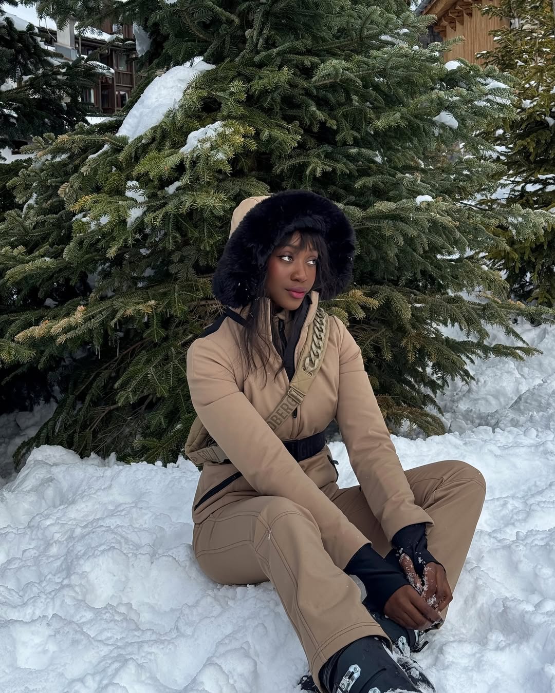 Emmanuelle Koffi with flushed cheeks and pink lips at Le Refuge de Solaise