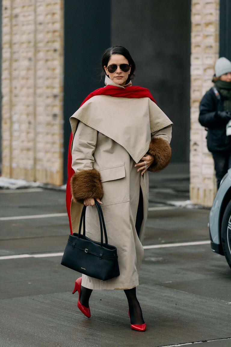 Photo of woman wearing coat at Copenhagen Fashion Week.