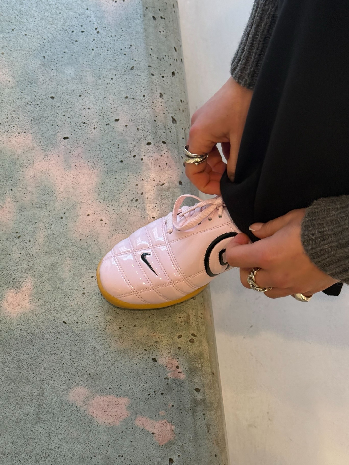 Close-up image of the Nike T90 trainers in pink.