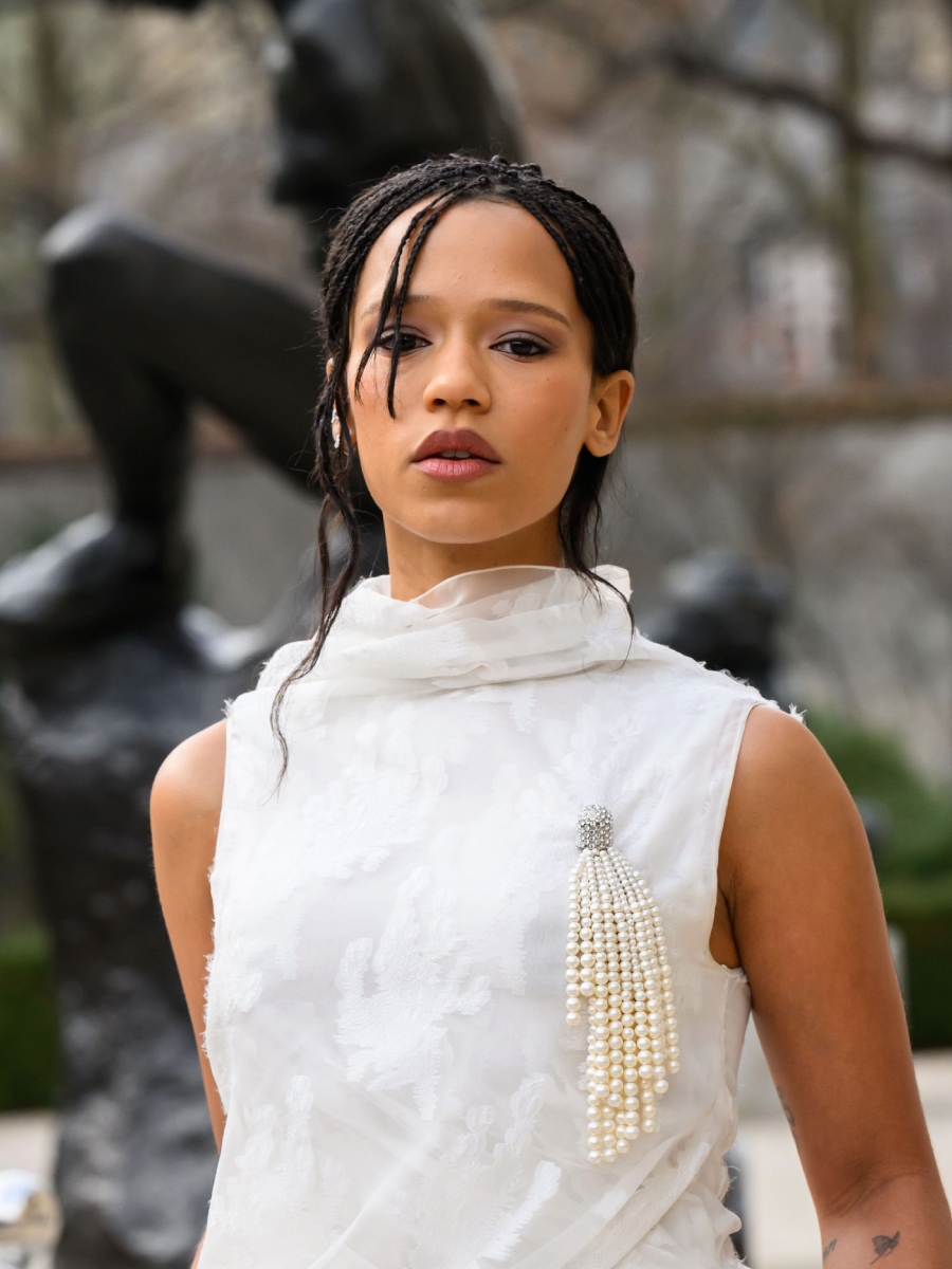 Taylor Russell attends the Christian Dior Haute Couture Week Spring/Summer 2026 show with upswept braids