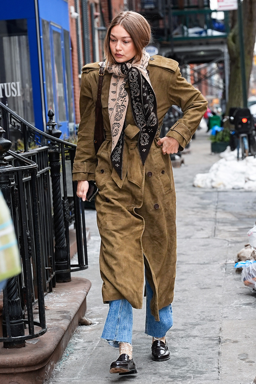 Gigi Hadid wearing a Guest in Residence Wild Rag scarf, suede Helsa coat, raw-hem jeans, and loafers in Manhattan