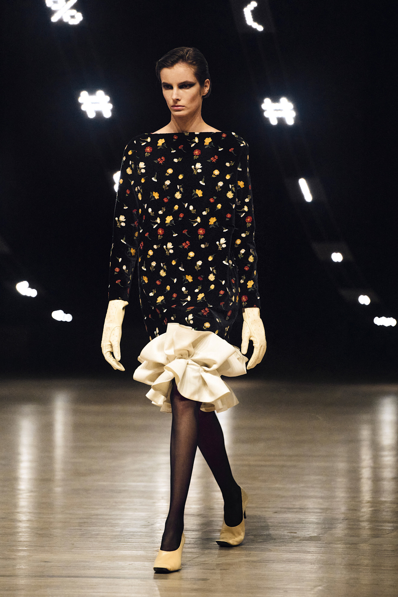 Photo of model wearing printed dress trend from New York Fashion Week Fall Winter 2026 runway show.