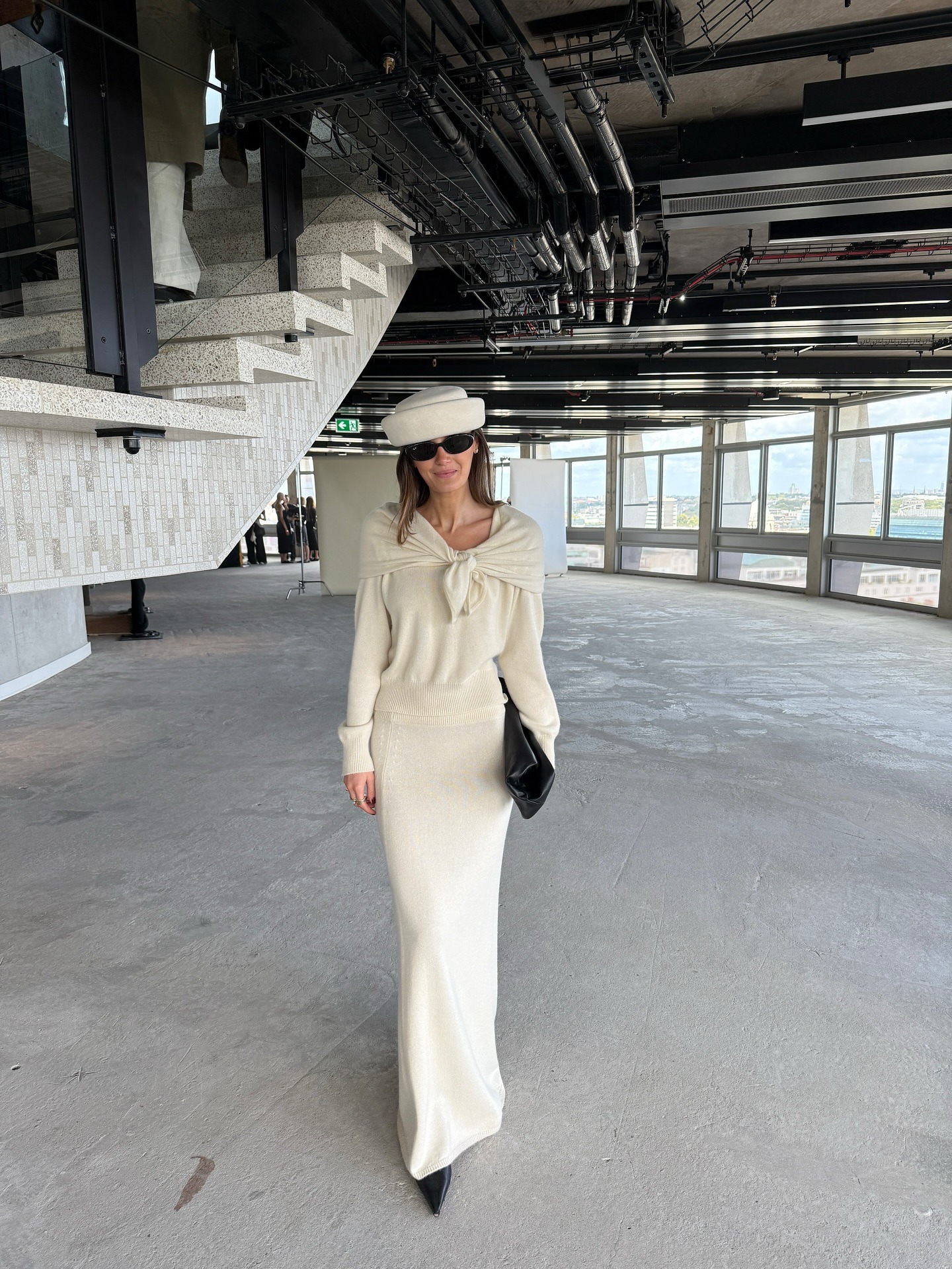 Influencer @cocoschiffer wears an all-cream knitted outfit.