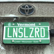 This backup camera cleaner hides behind your license plate