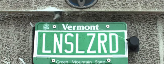 This backup camera cleaner hides behind your license plate