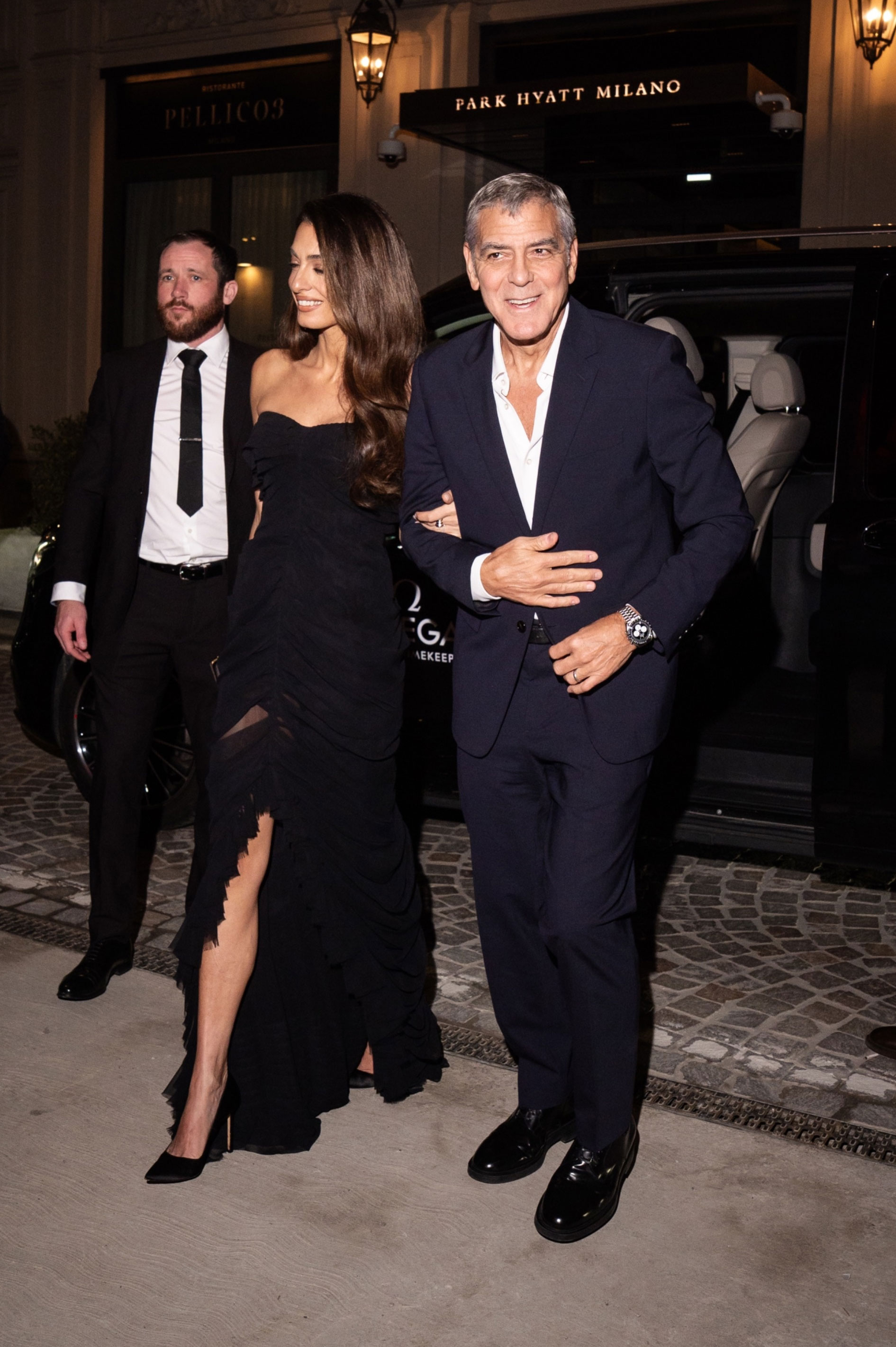 Amal Clooney wears a black dress to Omega House in Milan