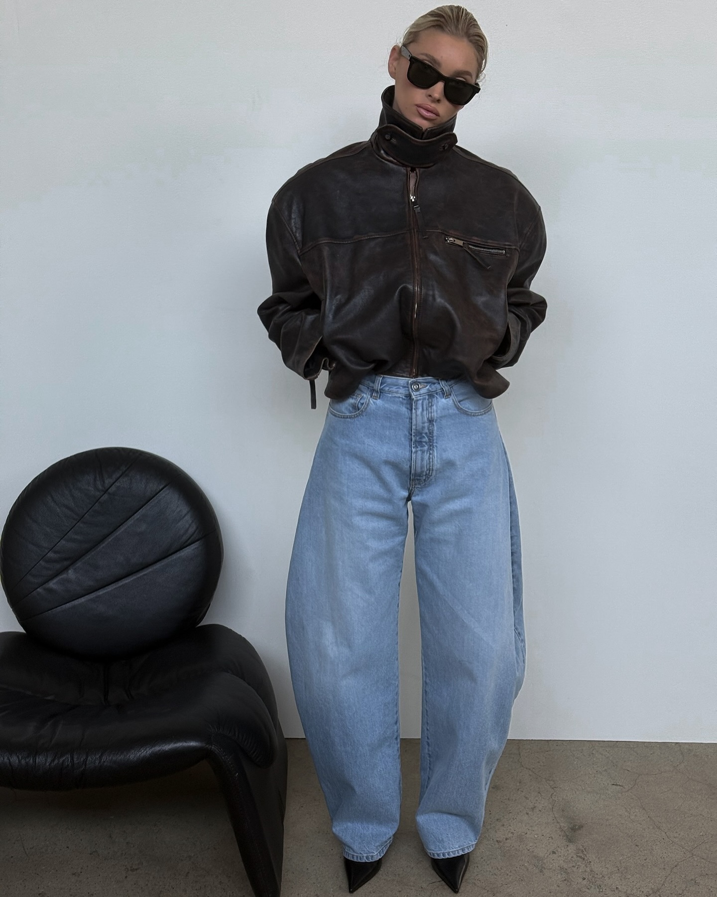 Elsa Hosk wears horseshoe jeans and a leather jacket