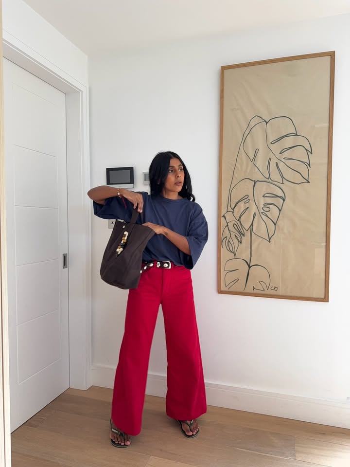 Monikh Dale wears red jeans and a grey t-shirt