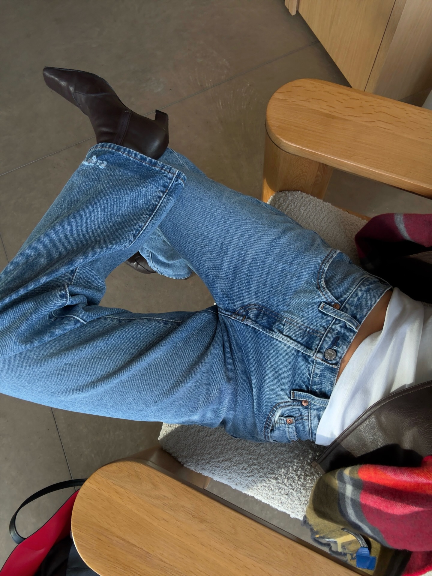 Marianne Smyth wears a blue straight leg jeans and leather ankle boots