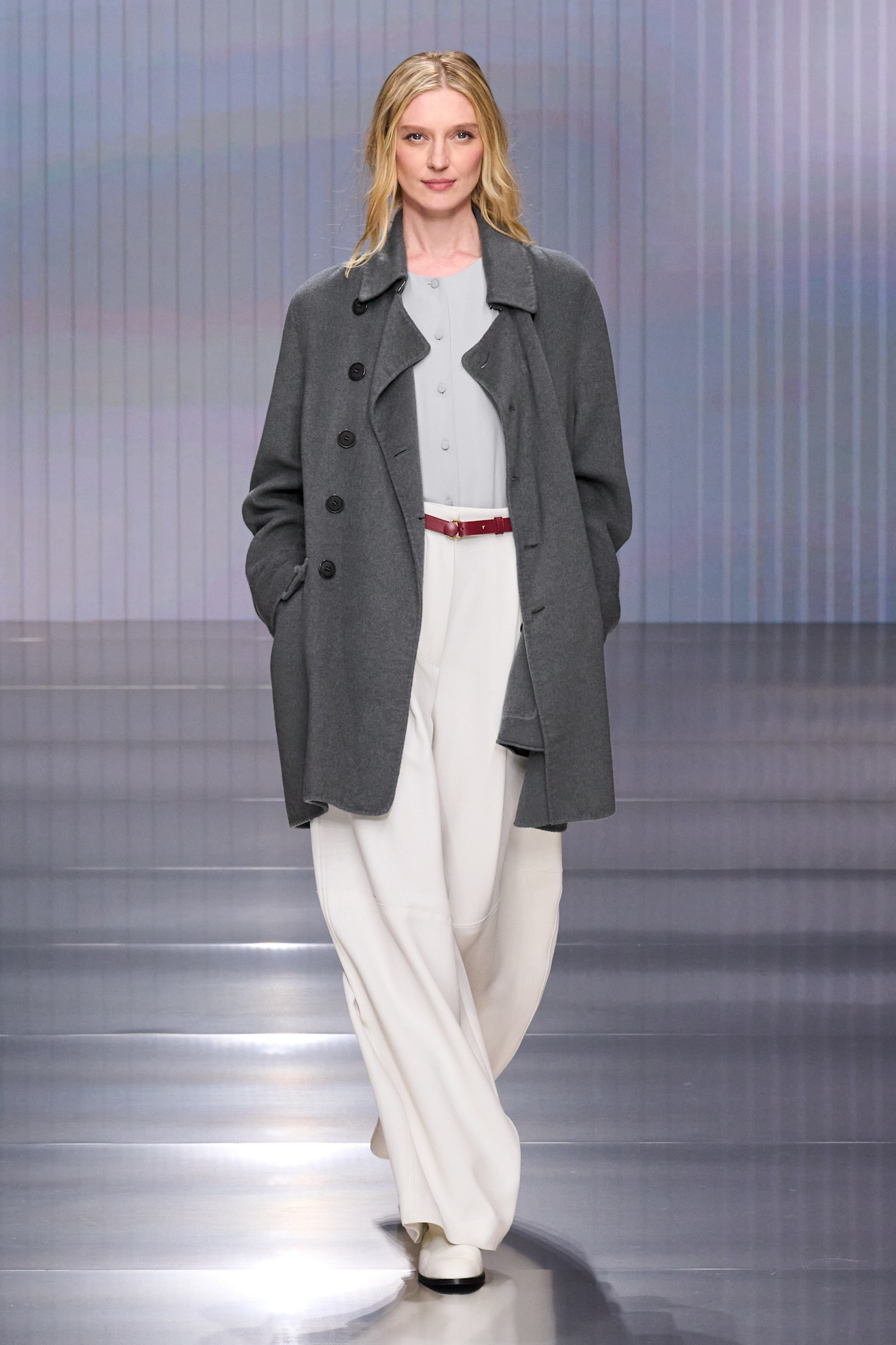 a model walks the giorgio armani show during milan fashion week.