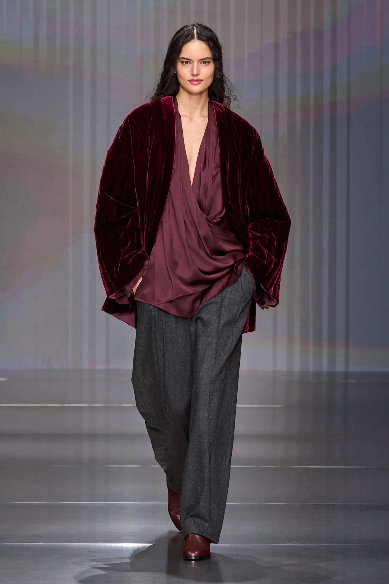 a model walks the giorgio armani show during milan fashion week.