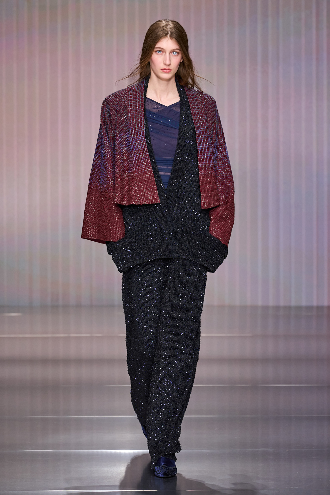 a model walks the giorgio armani fall/winter 2026 show.