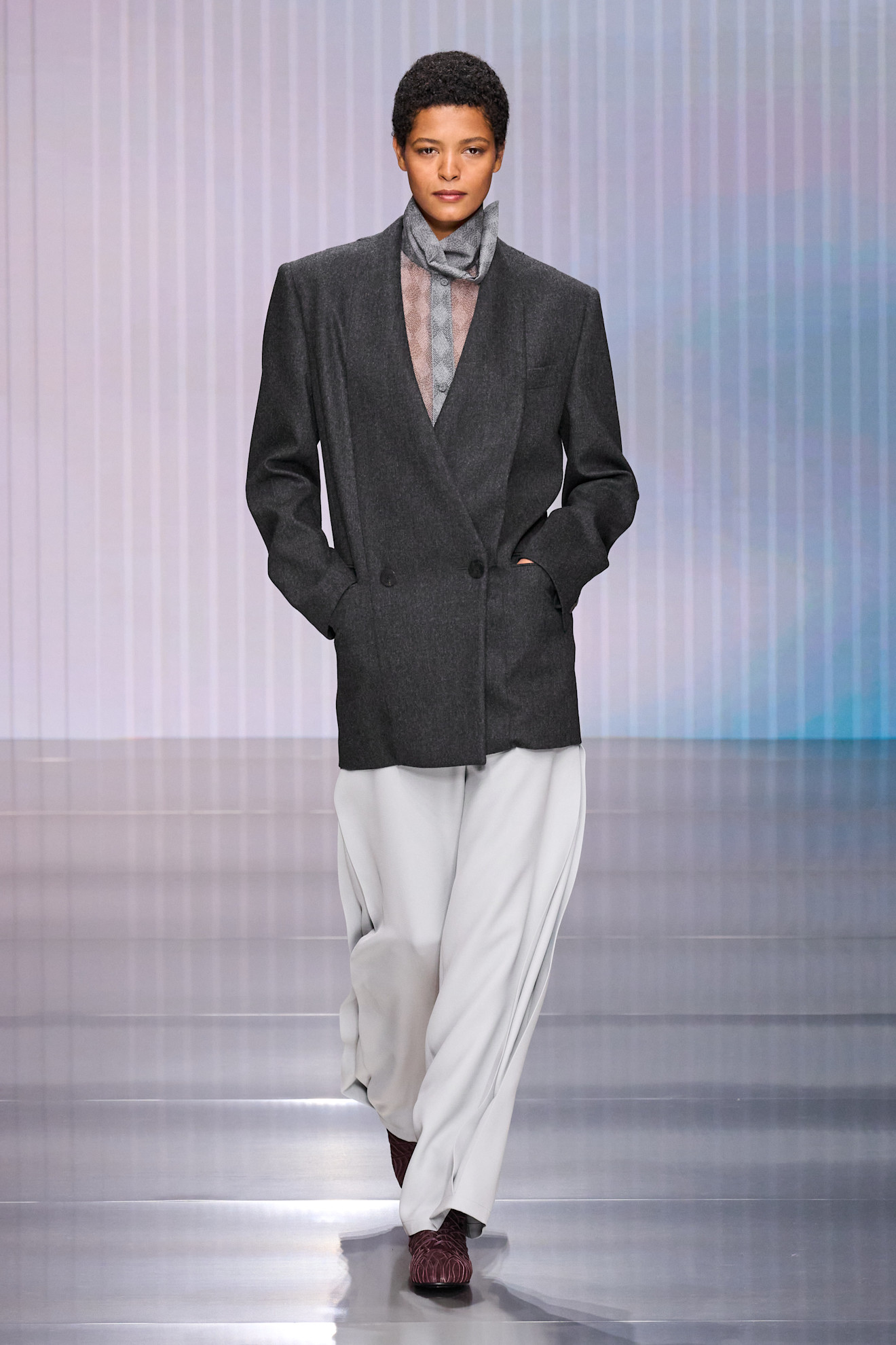 a model walks the giorgio armani fall/winter 2026 show.