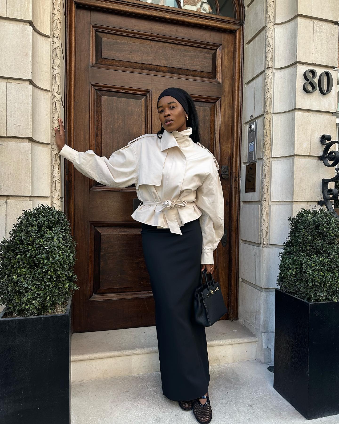 @nlmarilyn wearing the cropped trench coat trend