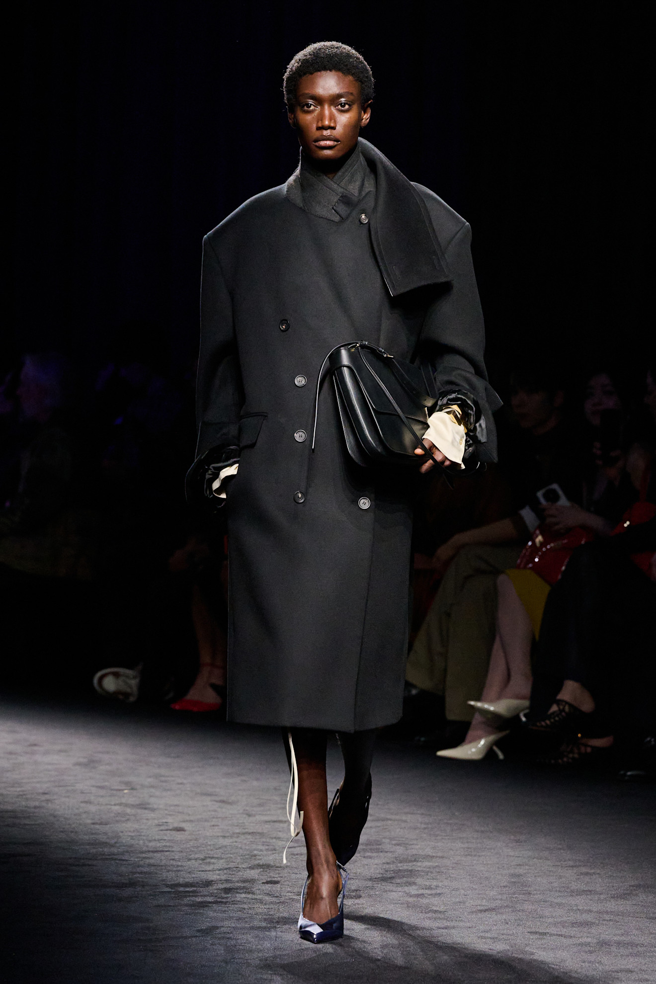 an image of a model wearing a coat from ferragamo f/w 26 show.