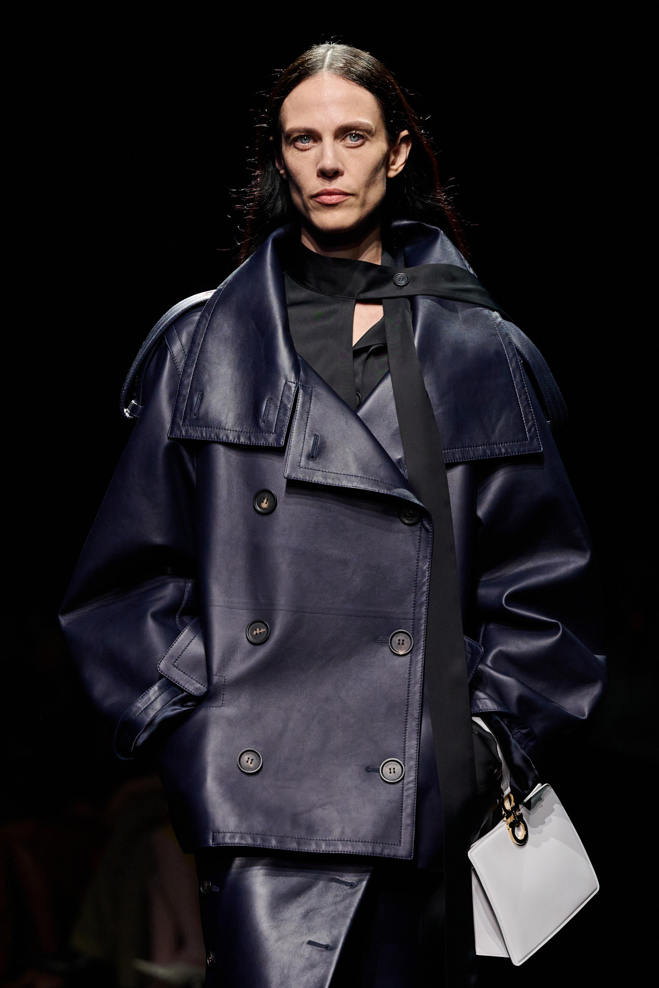 an image of a model wearing a coat from ferragamo f/w 26 show.