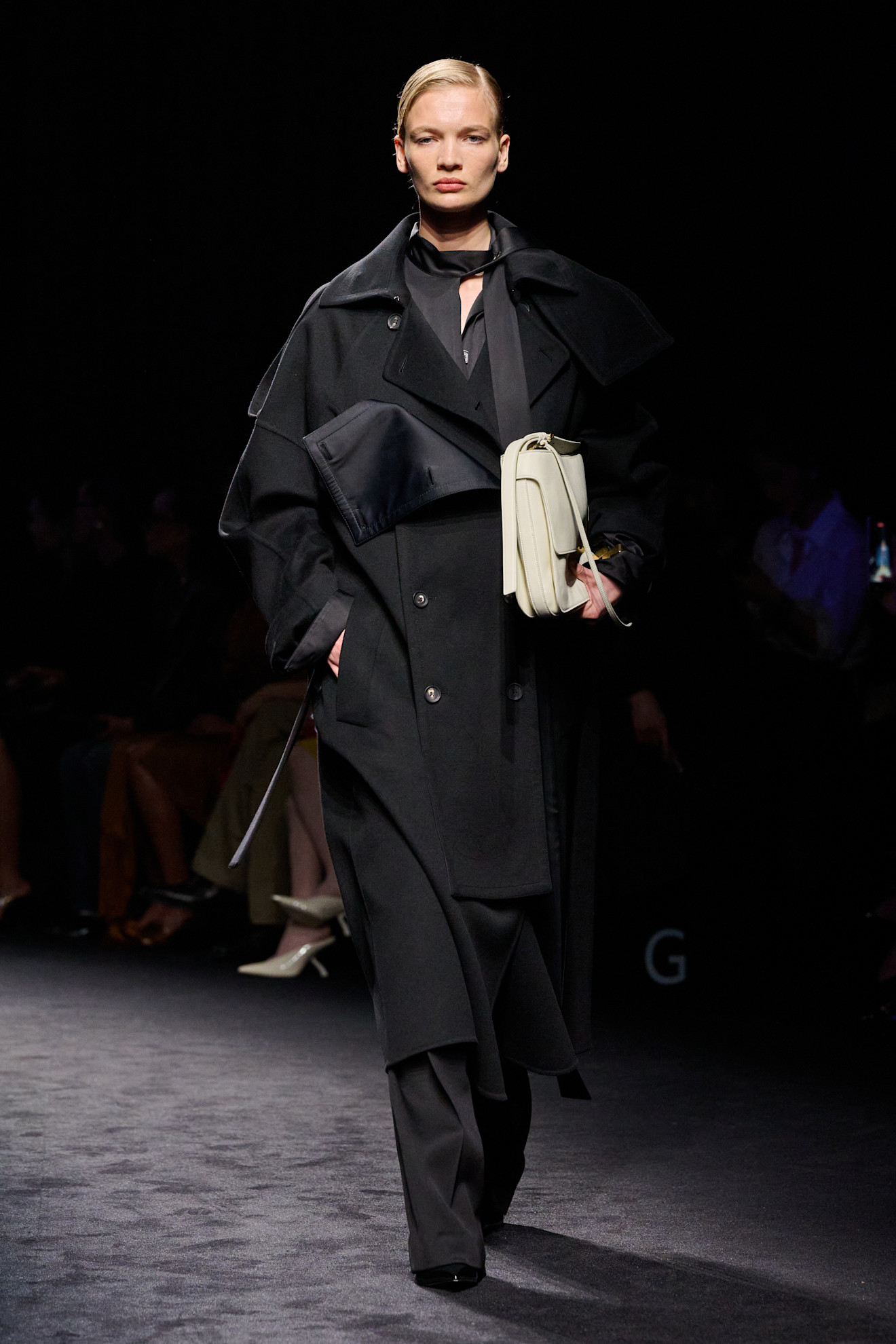 an image of a model wearing a coat from ferragamo f/w 26 show.