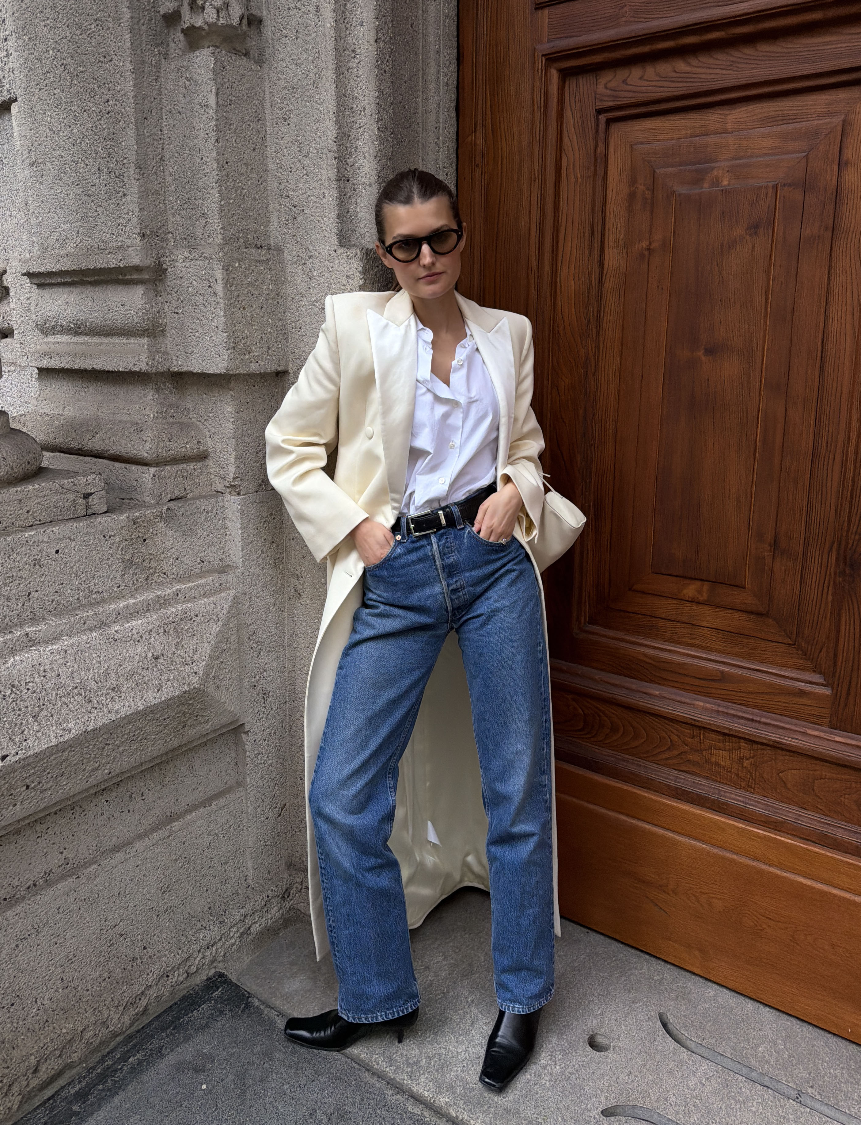 Woman in a long coat and jeans