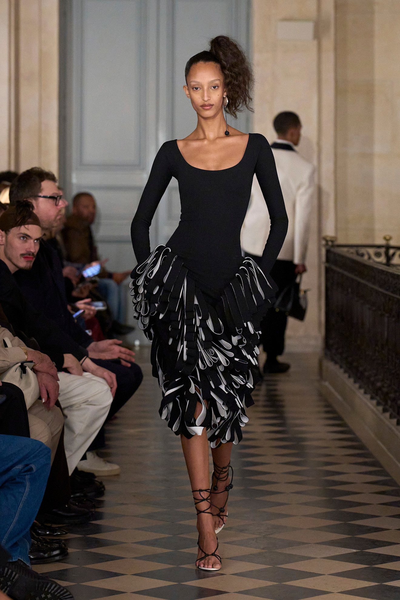Photos of models at Paris Fashion Week Fall Winter 2026 wearing basque waist trend.