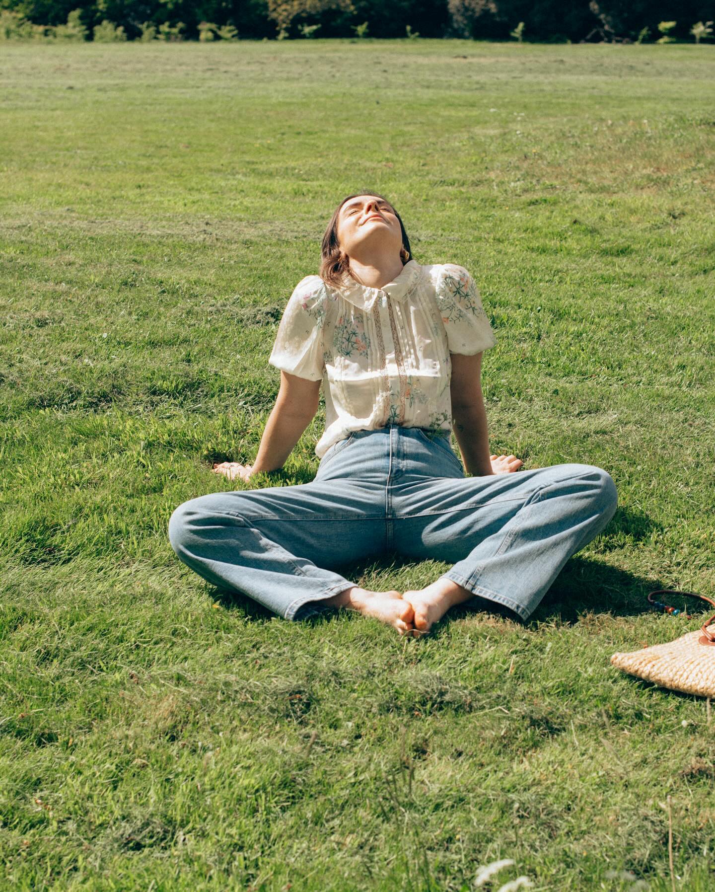 liv purvis wers a vintage inspired blouse and wide leg jeans