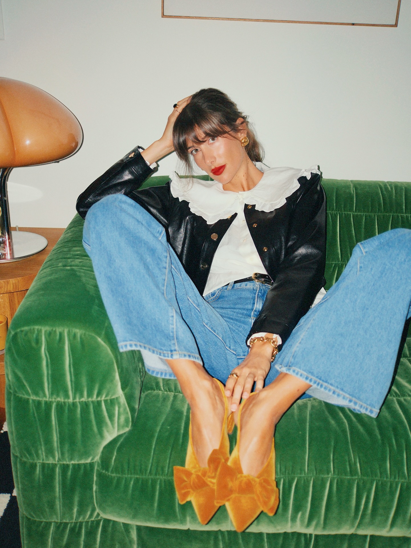 julie wears a peter pan collar blouse, jeans and bow flats