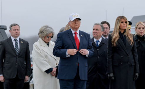 Not So Dignified: Donald Trump Dragged For Wearing His Tacky USA Hat During Ceremony Honoring Six Fallen Soldiers