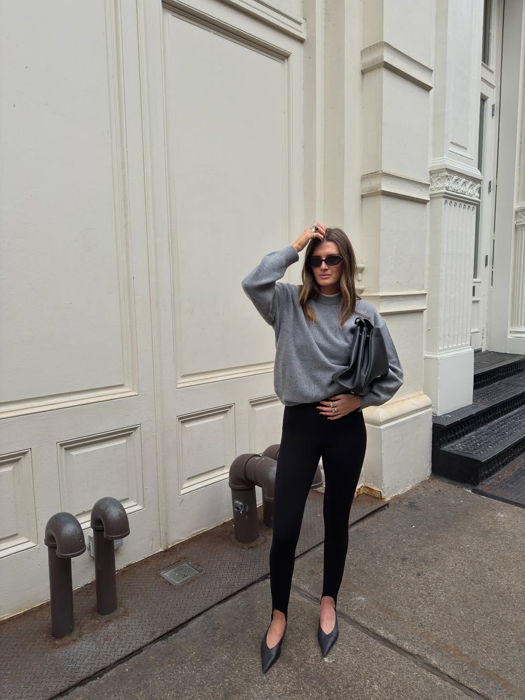 Coco in a grey jumper and leggings