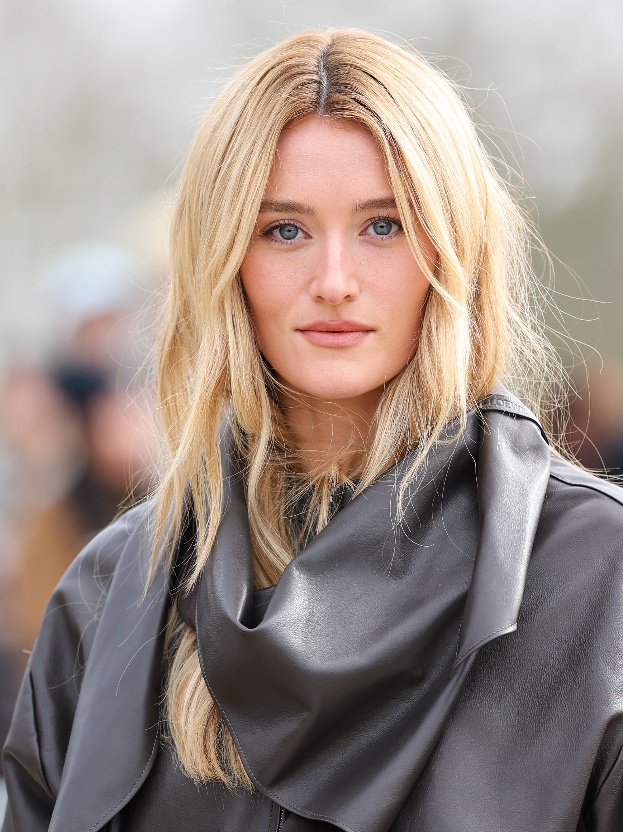 Sarah Pidgeon attends the Loewe Womenswear Fall/Winter 2026-2027 show as part of Paris Fashion Week with long, blonde hair