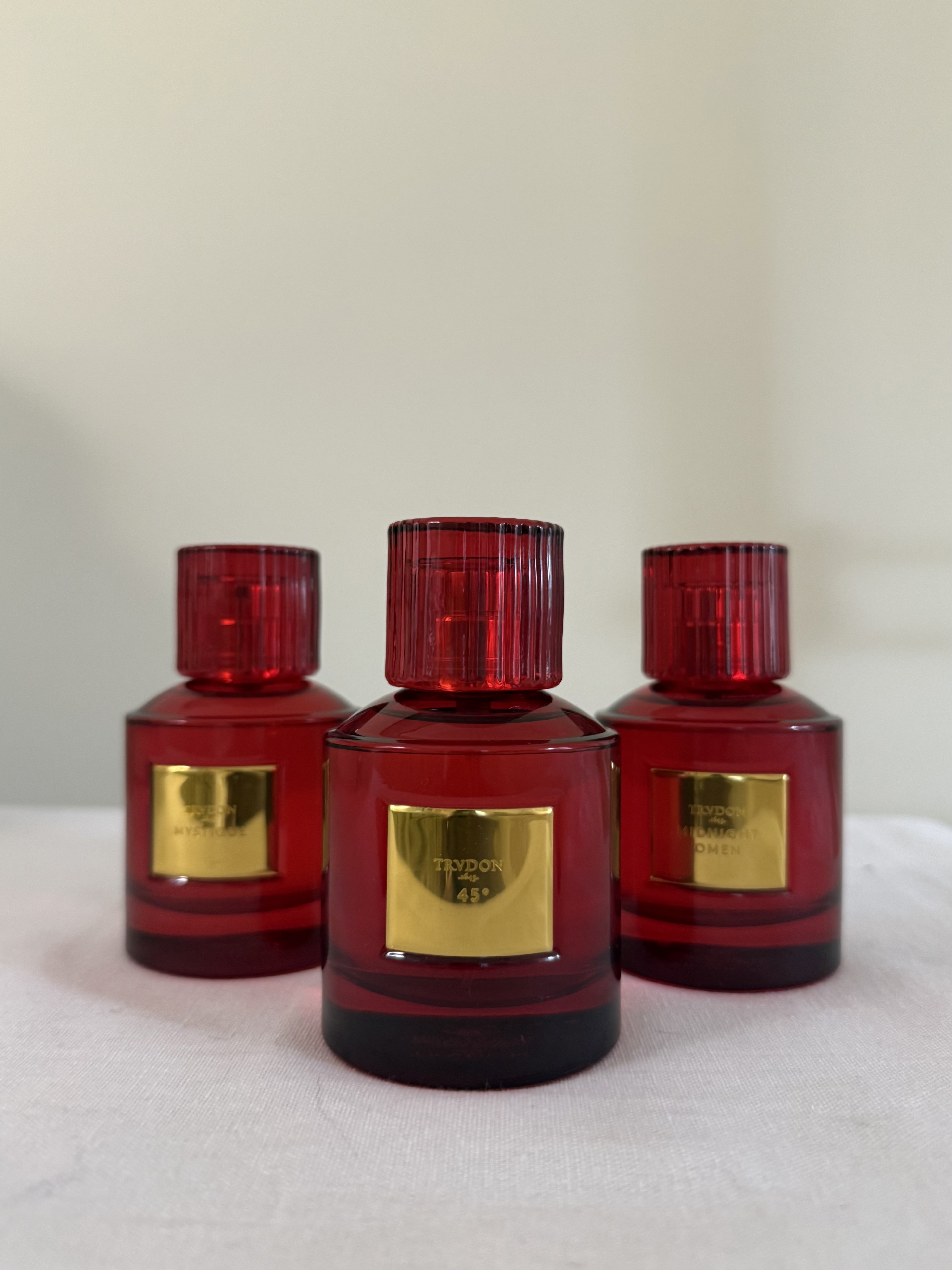 Bottles of Trudon's Nuit Rouge perfume collection.