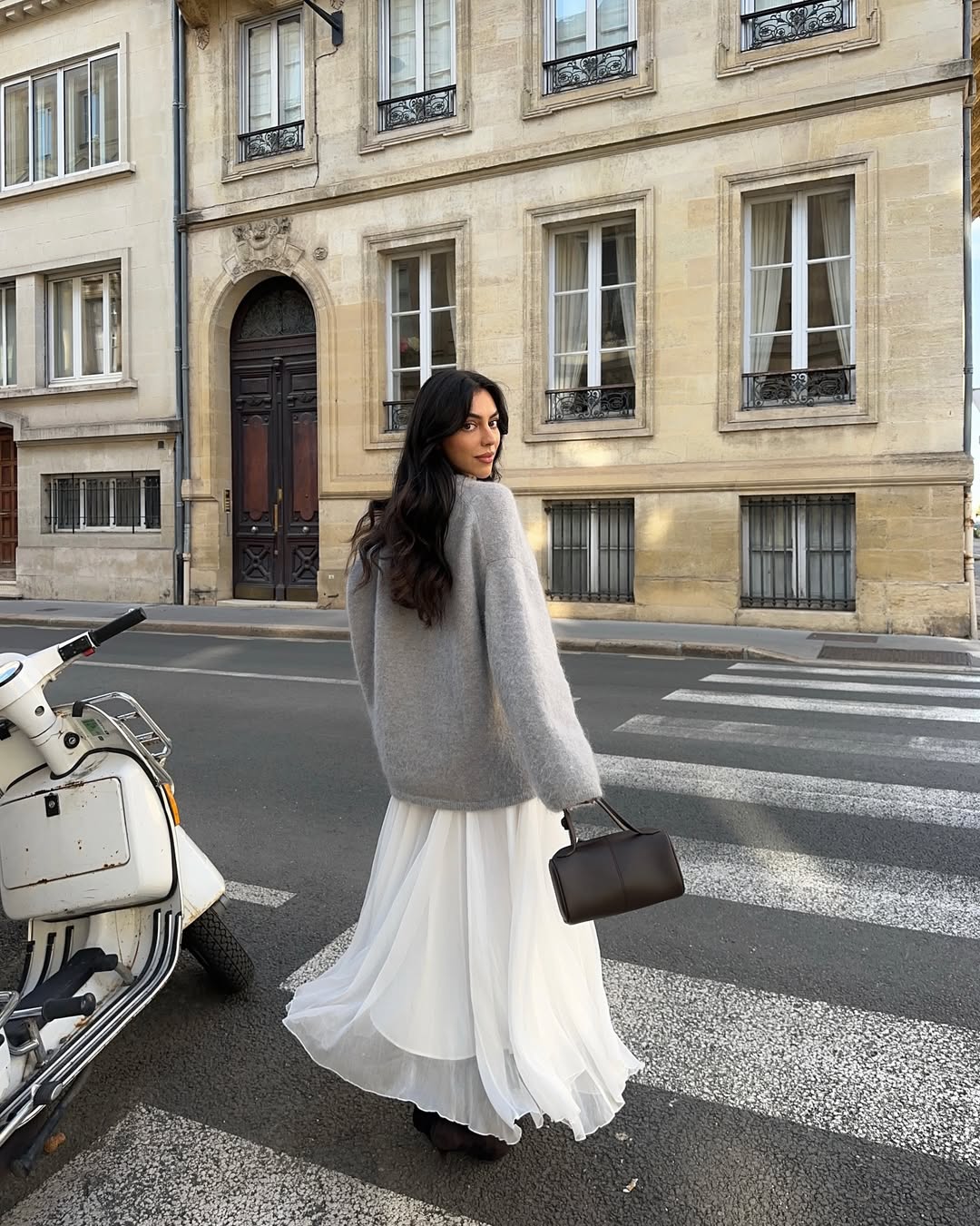 Mobina Peiman with long, glossy hair and natural makeup.