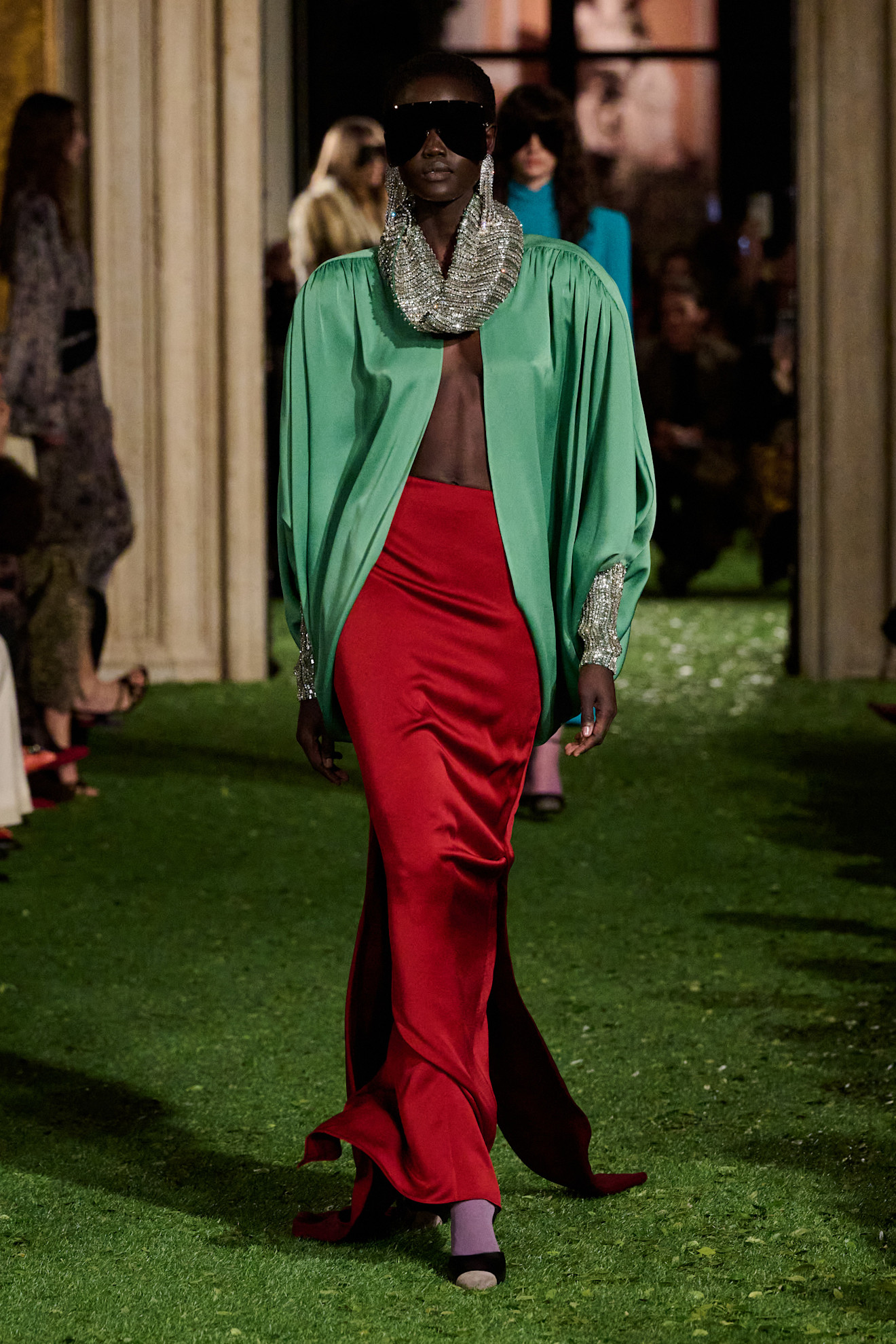 Photos of runway model at Valentino Fall Winter 2026 show.