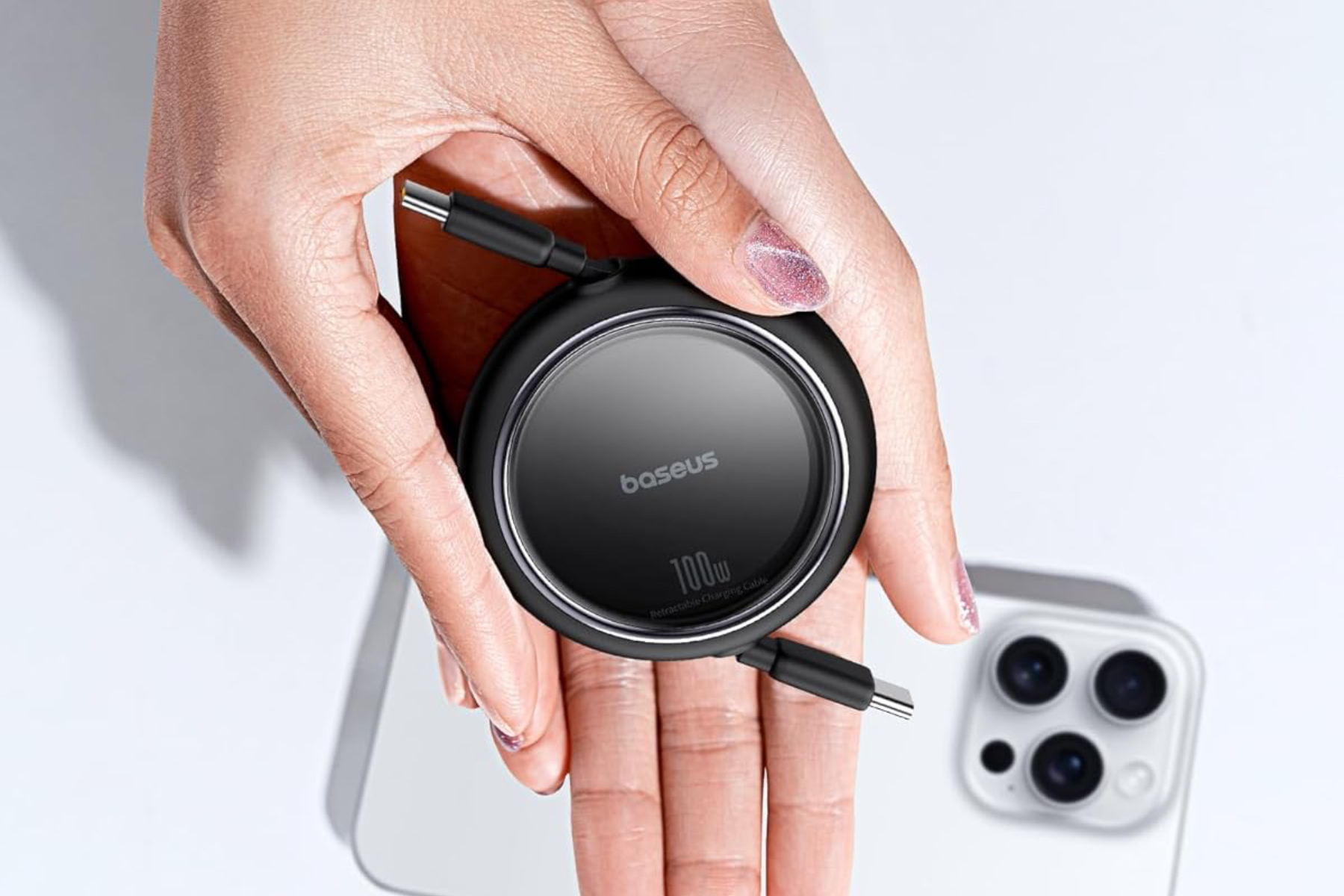 Baseus’ Free2Pull Retractable USB-C Cable in someone’s hand.