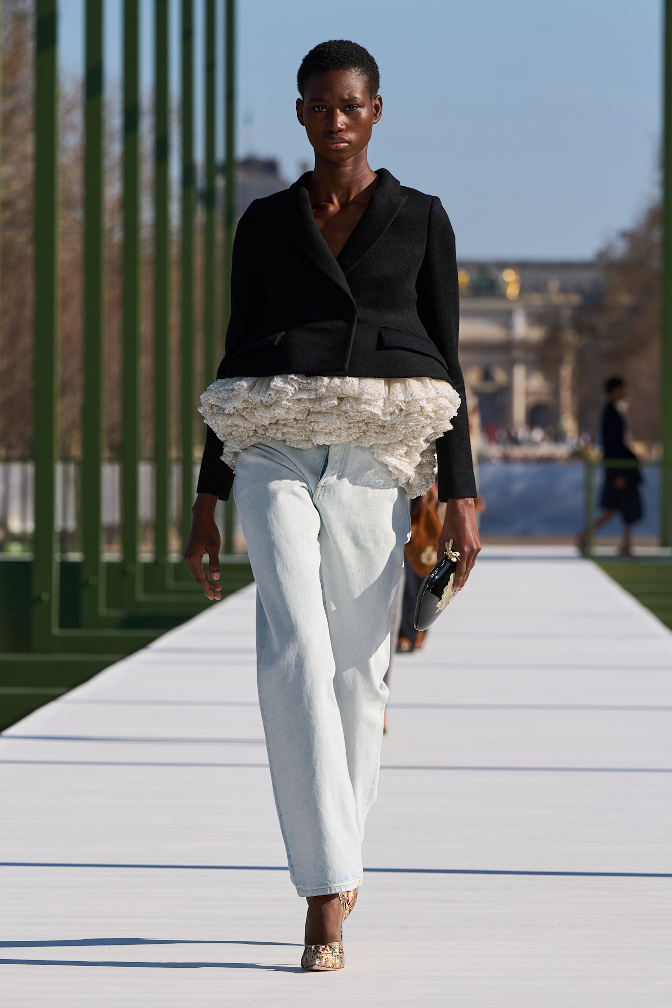 a model walks the christian dior f/w 26 runway.