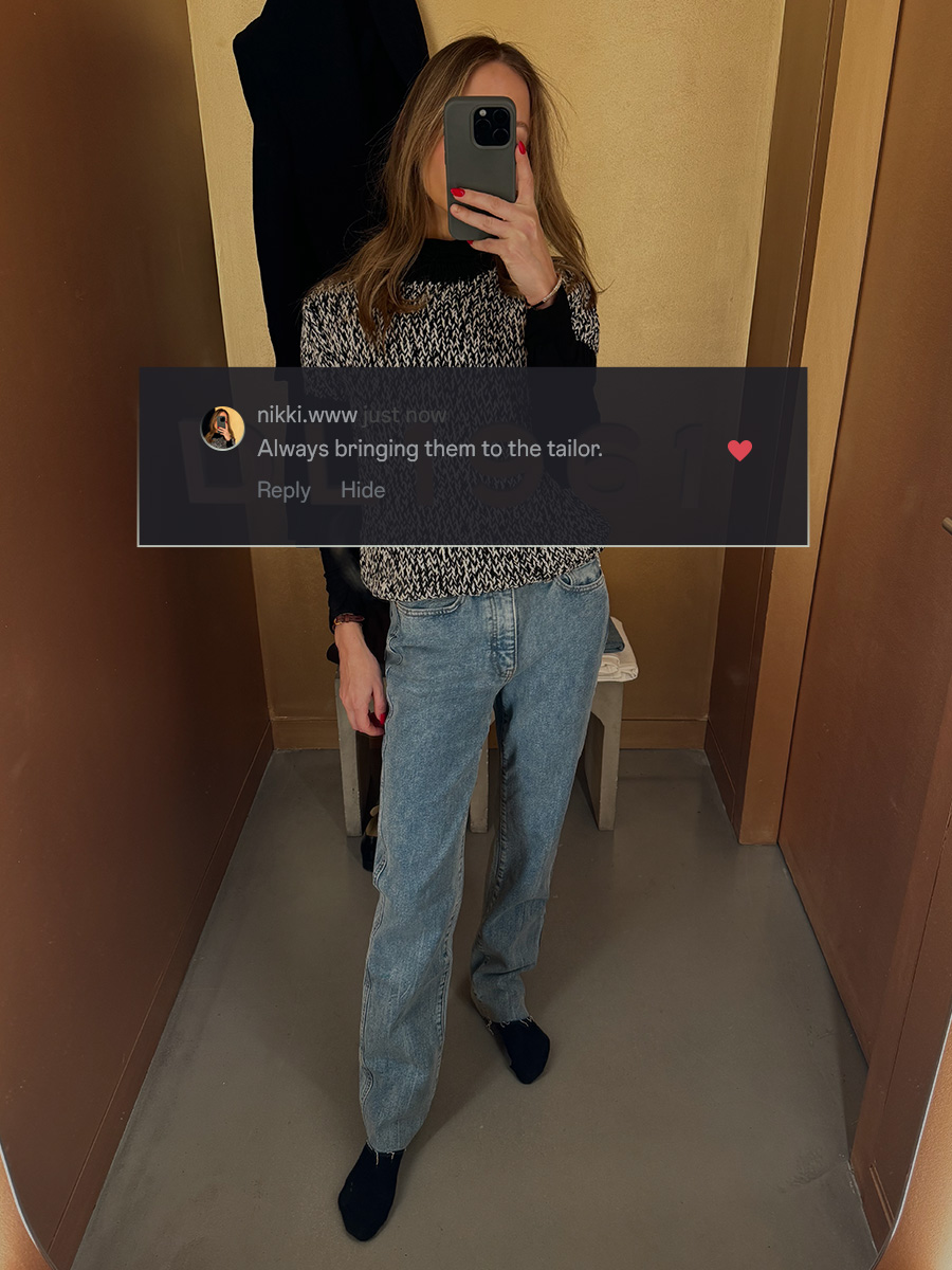 who what wear editor wearing denim posing in front of a mirror