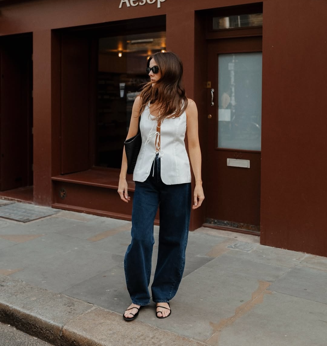 Kim in toe strap sandals and barrel jeans