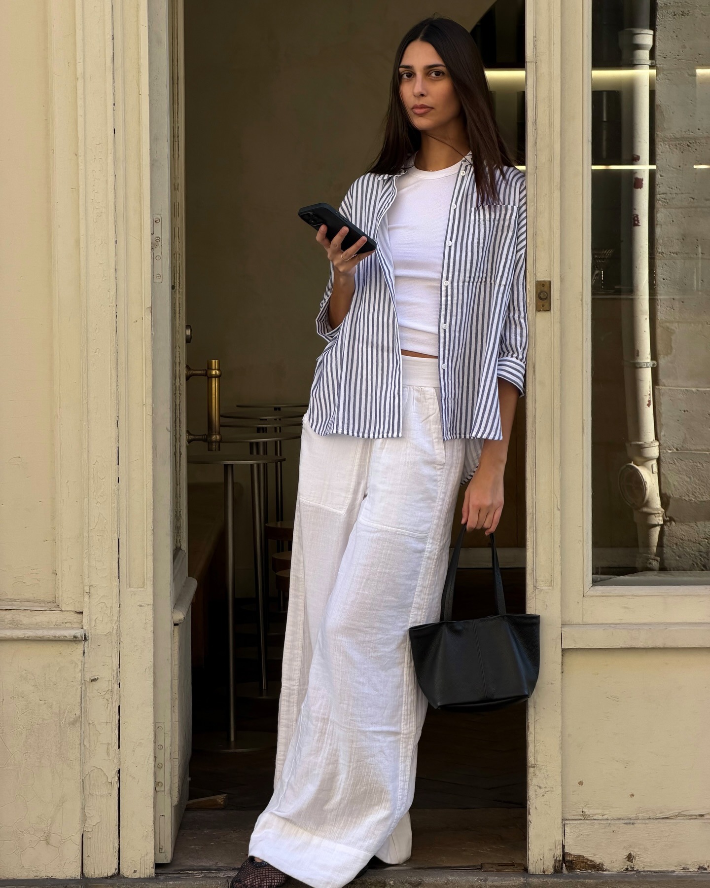 @salome.mory wearing Me and Em linen trousers and a striped button-down