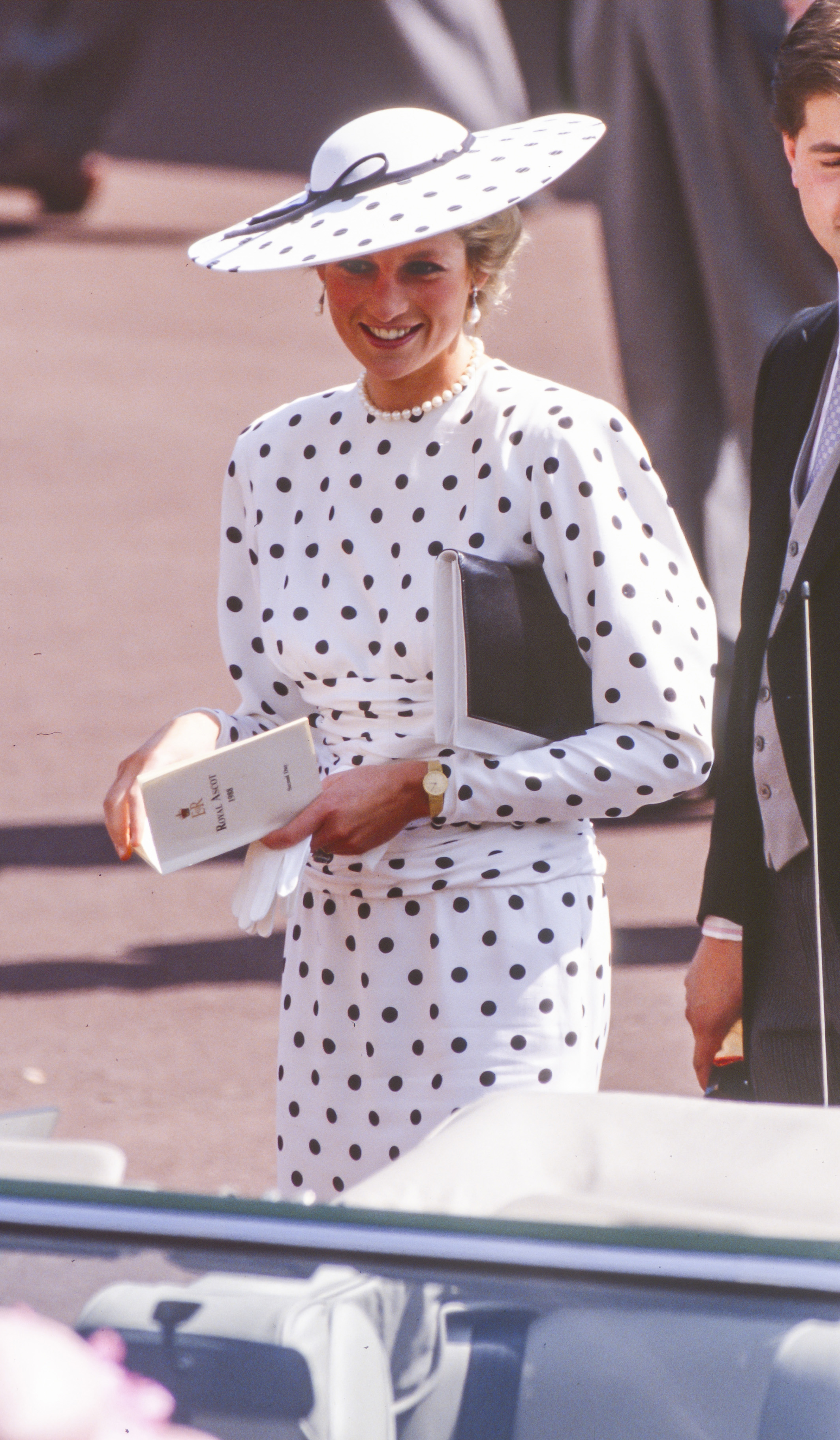 Princess Diana wears a polka dot dress.