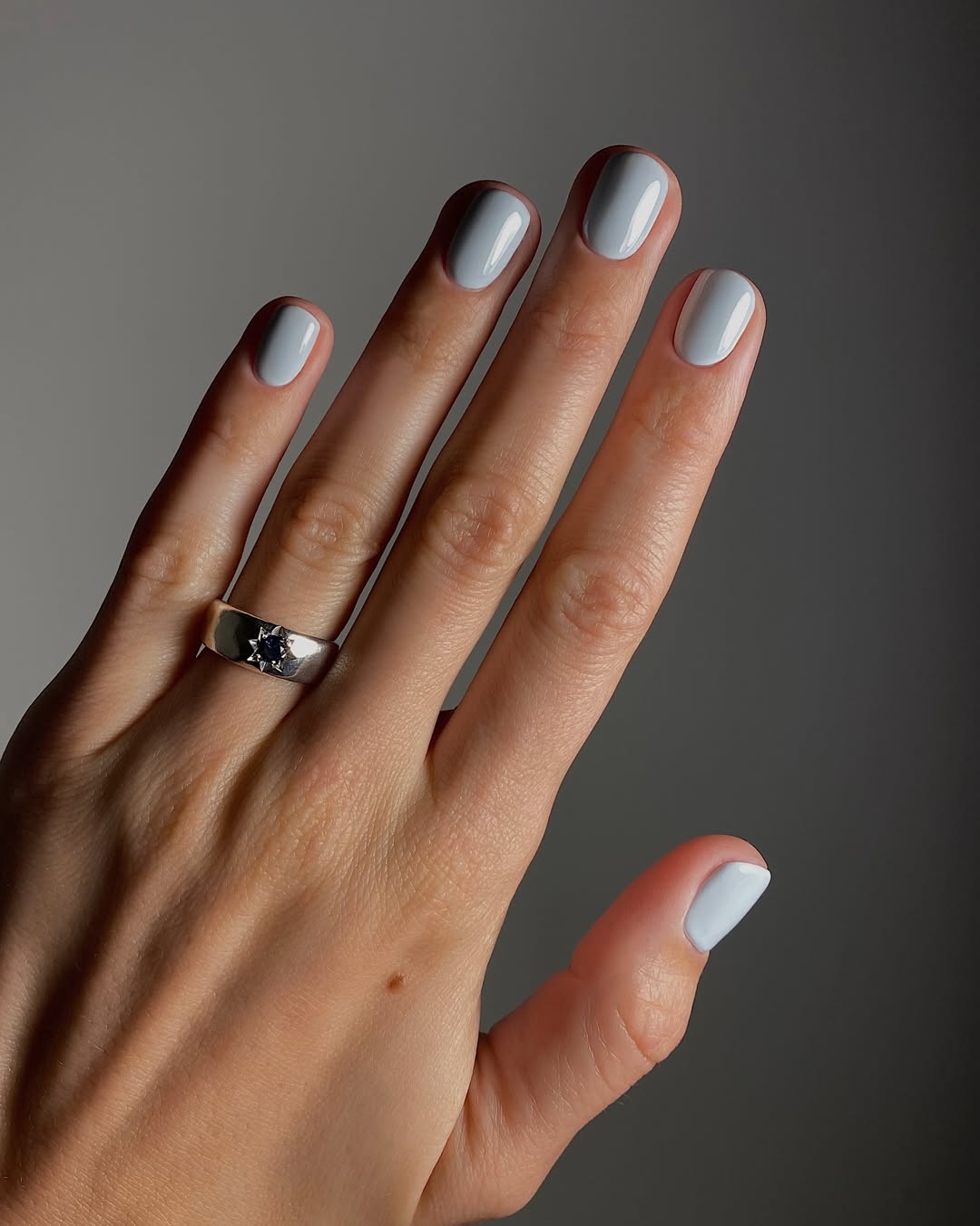 A misty blue manicure by Mateja Novakovic