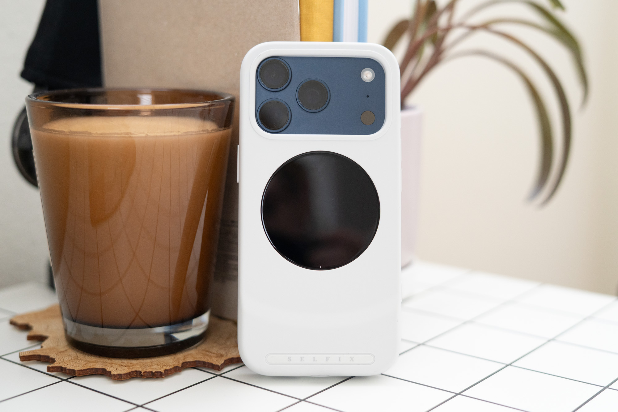 Selfix selfie phone case shown on an iPhone on a desk