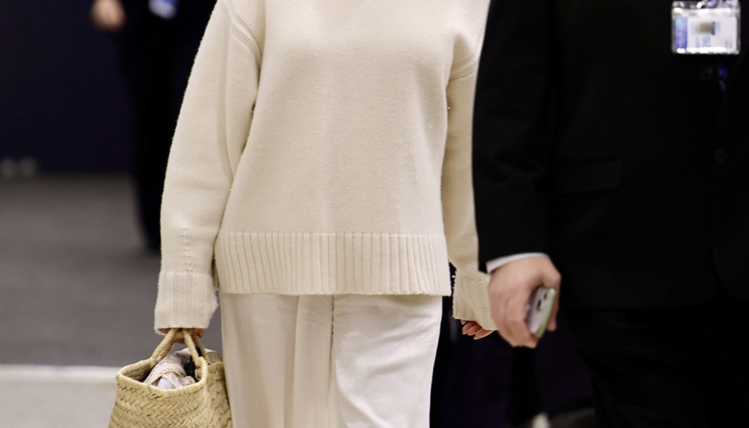 Pamela Anderson’s Airport Look Includes the French-Girl Shoe and Bag Combo I Actually Recommend Travelling With