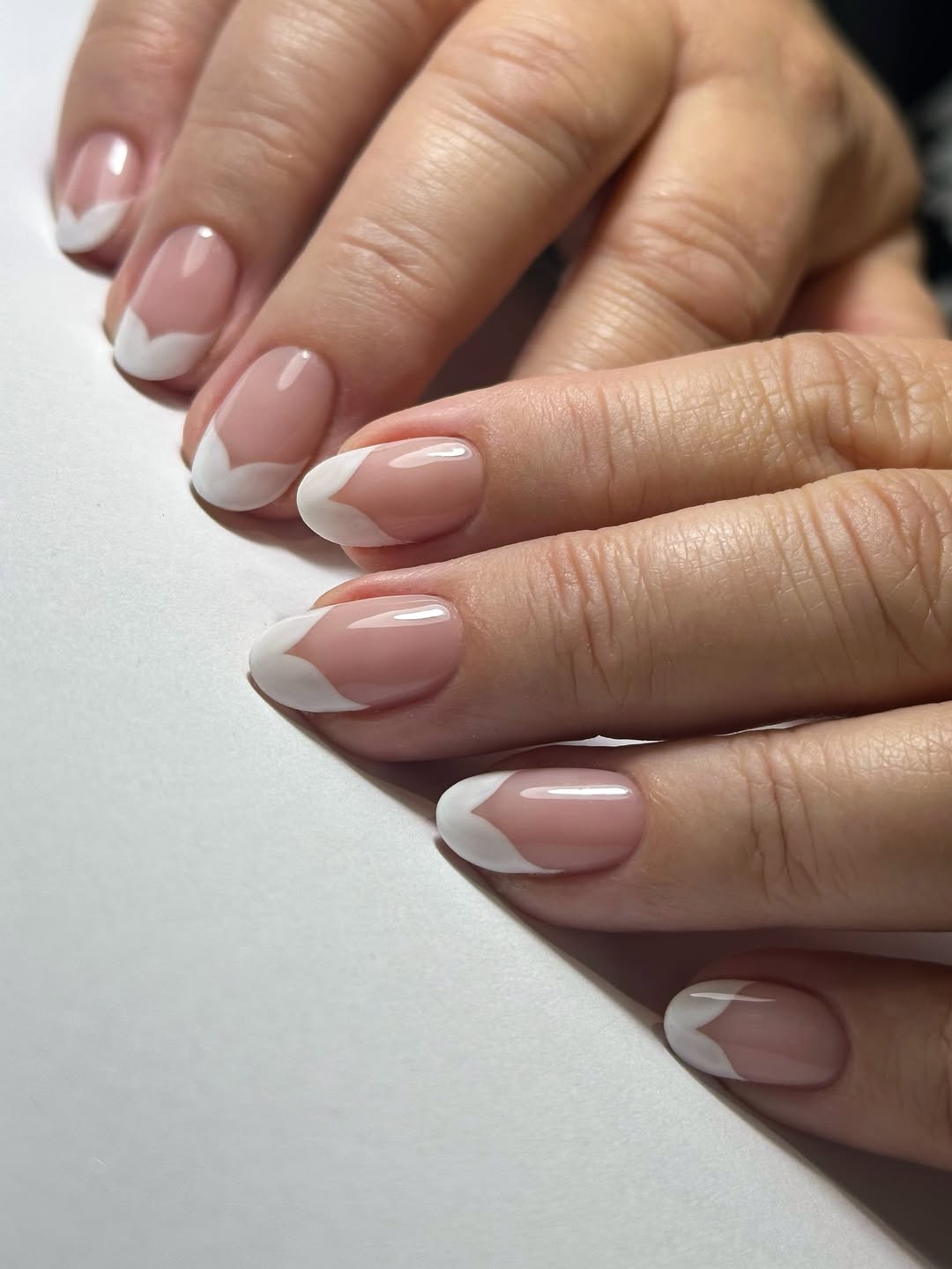 Sweetheart French nails.