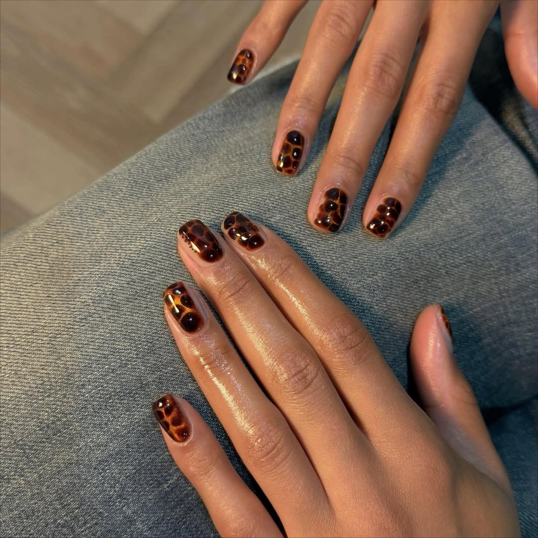 Tortoiseshell cat eye nails.